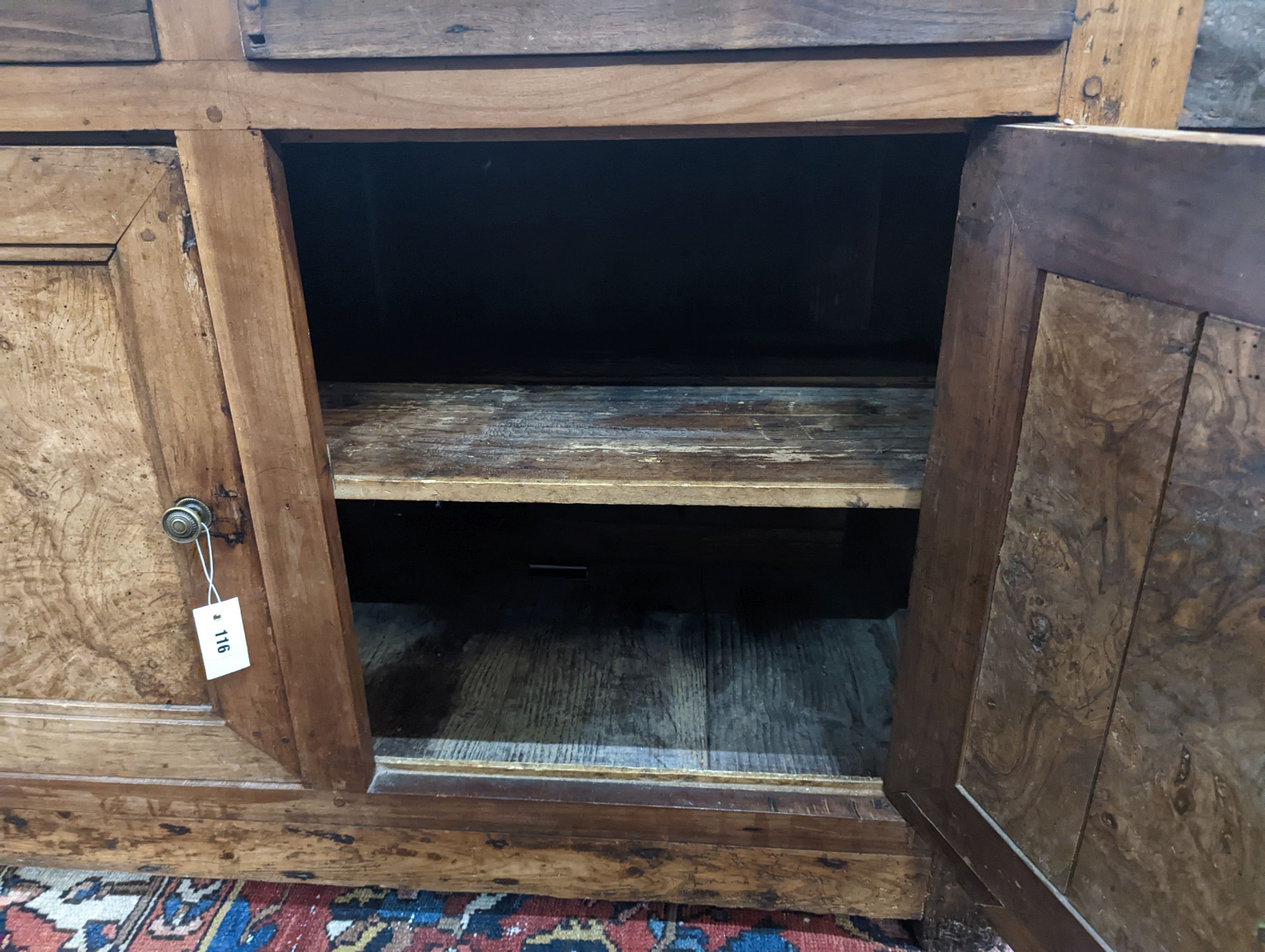 A late 18th / early 19th century French walnut and fruitwood side cabinet, width 130cm, depth 65cm, height 92cm